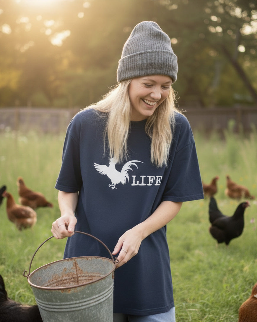 Woman feeding chickens with a chicken life t shirt